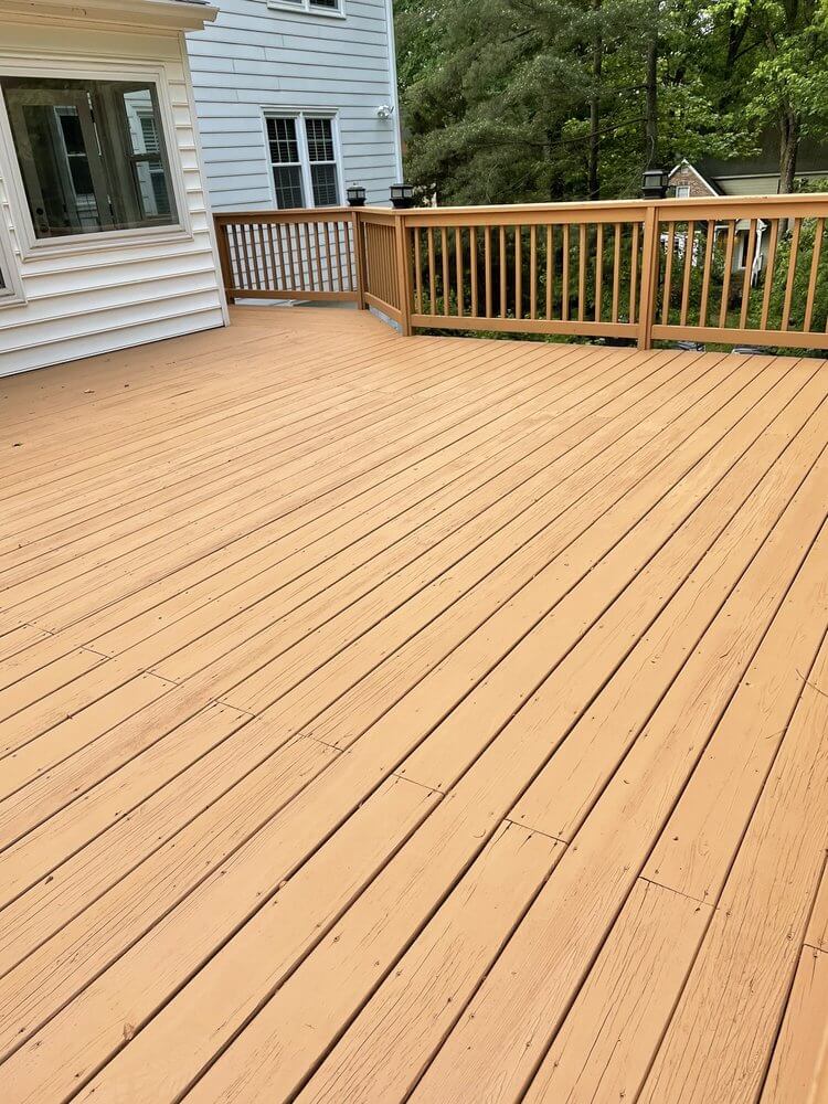 customer image of a beautifully pressure washed and stained back deck