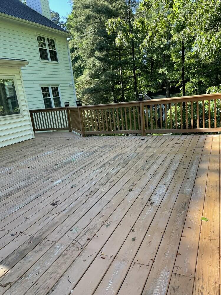 customer image of a beautifully pressure washed and stained back deck