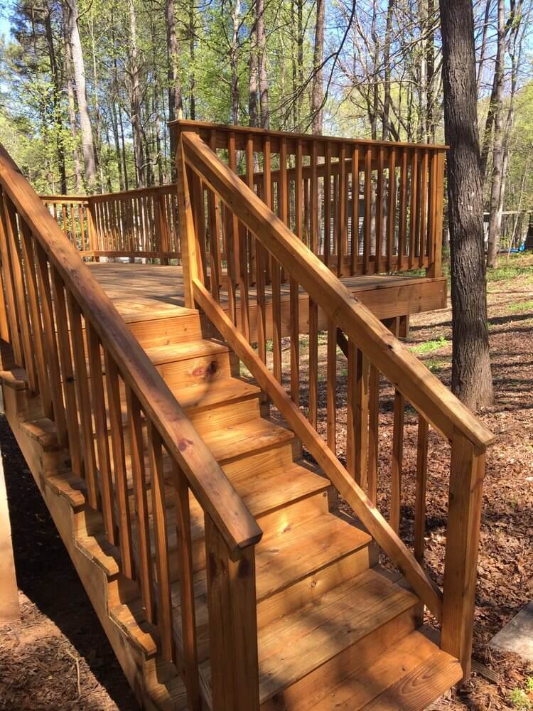 5 STAR REVIEW WITH CUSTOMER PHOTOS OF A BACK DECK THAT'S BEEN PRESSURE WASHED, STAINED, AND SEALED