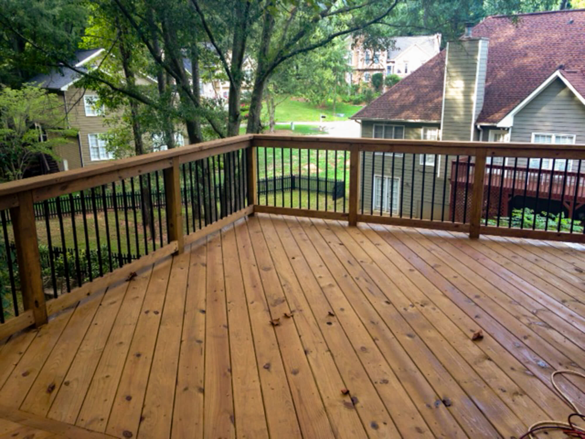 Deck pressure washing and deck stain and sealing near me. Professional cleaning results.