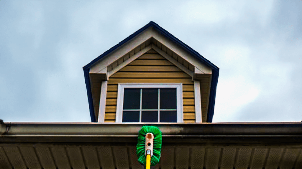 Professional cleaner removing stains from a gutter using safe cleaning solutions. Explore our Service Area Map to check if we’re in your neighborhood.